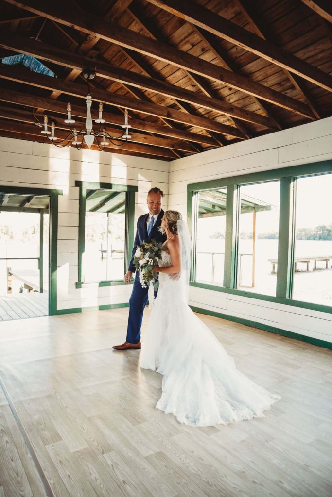 Bride and groom on the private dock at Crescent Lake during their intimate ceremony
