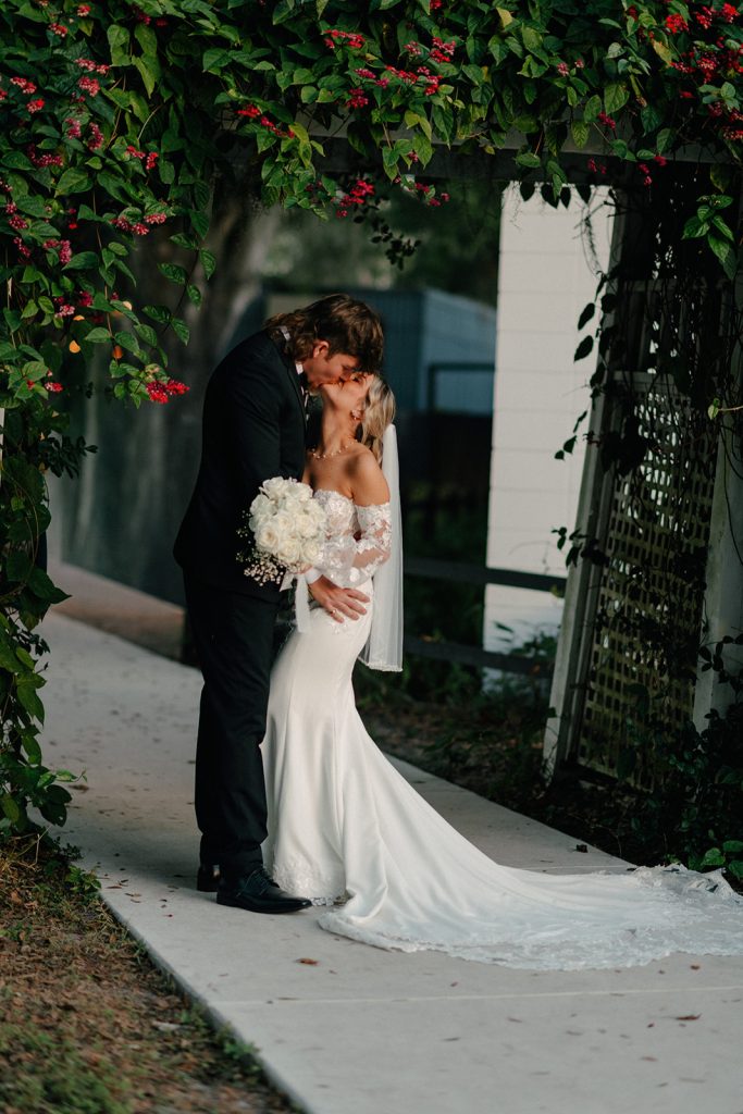 Intimate outdoor wedding ceremony on the lakefront lawn at The Barn at Crescent Lake, an elopement and ceremony-only venue in Tampa, FL